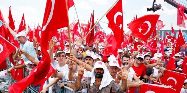 ISTANBUL, TURKEY - AUGUST 7: People hold Turkish flags as they arrive to take part in Democracy and Martyrs' Rally in Istanbul, which will be held in protest against the July 15 foiled coup by the Fetullah Terrorist Organization (FETO), on August 7, 2016. Turkish officials accuse U.S.-based Turkish citizen Fetullah Gulen plotting to overthrow the government of President Erdogan as the culmination of a long running campaign to infiltrate Turkish institutions including the military, the police and the judiciary. (Photo by Bulent Doruk/Anadolu Agency/Getty Images)