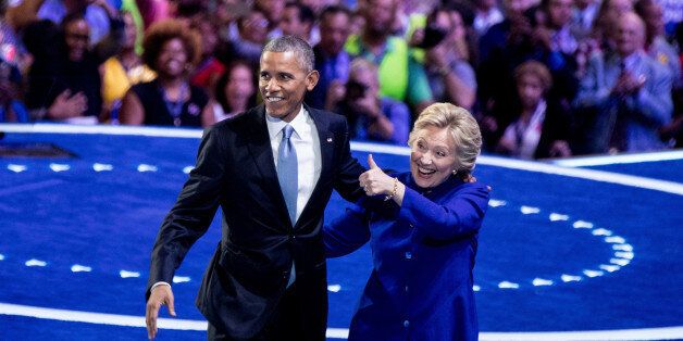 President Barack Obama and Democratic presidential candidate Hillary Clinton appear on stage together on the third day session of the Democratic National Convention in Philadelphia, Wednesday, July 27, 2016. (AP Photo/Andrew Harnik)