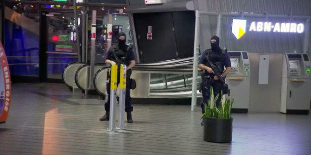This image made from a video from RTL shows police at Schiphol Airport in Amsterdam, Tuesday, April 12, 2016. Military police have arrested a man and are conducting an investigation at the airport after a report of a