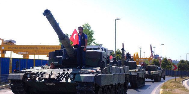 Police officers drive some of the tanks that were used by soldiers participating in the attempted coup, back to the Selimiye Army Base in Istanbul, Saturday, July 16, 2016. Turkish President Recep Tayyip Erdogan told the nation Saturday that his government was working to crush a coup attempt after a night of explosions, air battles and gunfire across the capital that left dozens dead and scores wounded. (AP Photo/Cansu Alkaya)
