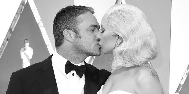 HOLLYWOOD, CA - FEBRUARY 28: (EDITORS NOTE: Image has been converted to black and white.) Taylor Kinney and Lady Gaga arrives at the 88th Annual Academy Awards at Hollywood & Highland Center on February 28, 2016 in Hollywood, California. (Photo by Steve Granitz/WireImage)