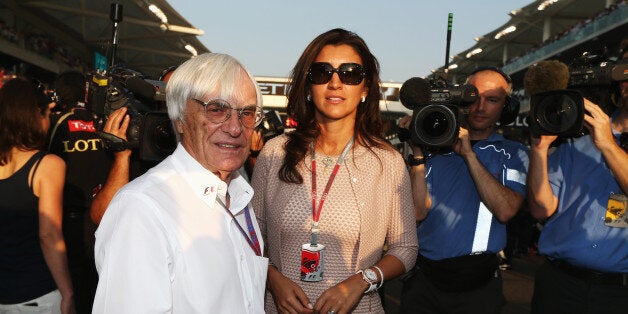 ABU DHABI, UNITED ARAB EMIRATES - NOVEMBER 04: F1 supremo Bernie Ecclestone and his wife Fabiana Flosi are seen on the grid before the Abu Dhabi Formula One Grand Prix at the Yas Marina Circuit on November 4, 2012 in Abu Dhabi, United Arab Emirates. (Photo by Mark Thompson/Getty Images)