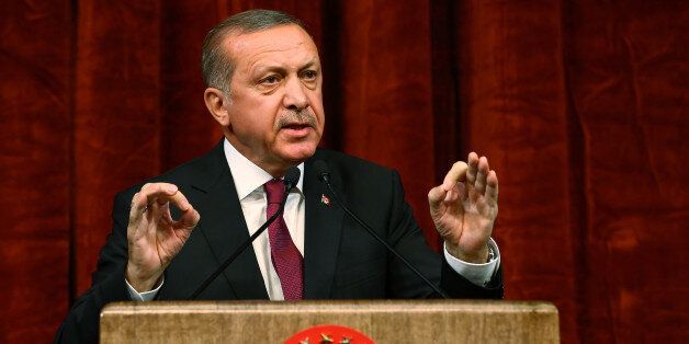 Turkey President Recep Tayyip Erdogan gives a speech commemorating those killed and wounded during a failed July 15 military coup, in Ankara, Turkey, late Friday, July 29, 2016. The government crackdown in the coup's aftermath has strained Turkey's ties with key allies including the United States. (AP Photo/Kayhan Ozer Presidential Press Service, via AP Pool)