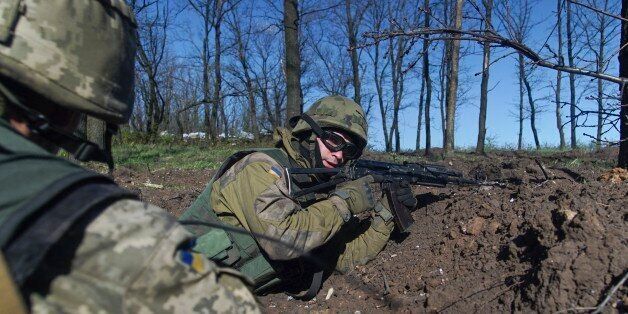 Ukrainian military servicemen control their position during a ceasefire outside Avdiivka, eastern Ukraine, Saturday, April 16, 2016. Fighting between Russia-backed separatists and government troops in eastern Ukraine has claimed more than 9,100 lives since April 2014, and a political settlement remains a dim prospect. (AP Photo/Max Black)