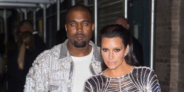 NEW YORK, NY - MAY 02: Rapper Kanye West (L) and tv personality Kim Kardashian attend 'Manus x Machina: Fashion in an Age of Technology' Costume Institute Gala Balmain after party at Gilded Lily on May 2, 2016 in New York City. (Photo by Michael Stewart/Getty Images)