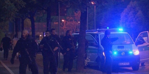 A screen grab taken from video footage shows police officers near the Olympia shopping mall following a shooting rampage in Munich, Germany July 22, 2016. REUTERS/Reuters TV