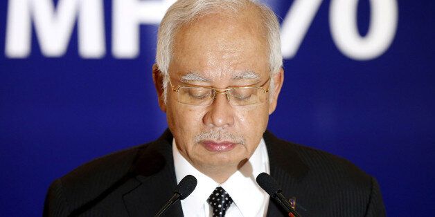 FILE PHOTO: Malaysia's Prime Minister Najib Razak confirms the debris found on Reunion Island is from missing Malaysia Airlines flight MH370 in Kuala Lumpur, Malaysia, early August 6, 2015. REUTERS/Olivia Harris/File photo