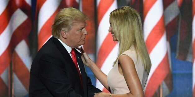 Republican presidential candidate Donald Trump embraces his daughter Ivanka after she delivered a speech on the final night of the Republican National Convention at the Quicken Loans Arena in Cleveland, Ohio on July 21, 2016. / AFP / Jim WATSON (Photo credit should read JIM WATSON/AFP/Getty Images)