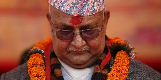 Nepal's Prime Minister Khadga Prasad Sharma Oli, also known as K.P. Oli, observes a minute of silence for earthquake victims during an event organised to mark the 18th National Earthquake Safety Day and the official launch of earthquake reconstruction efforts in Bungamati village, Nepal January 16, 2016. REUTERS/Navesh Chitrakar/File photo