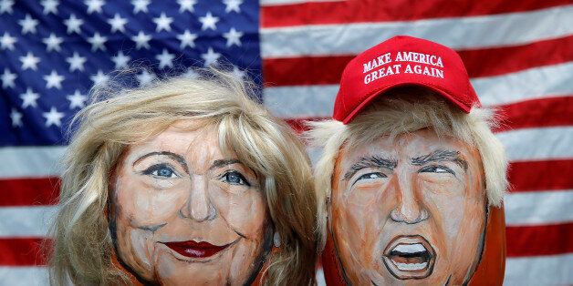 The images of U.S. Democratic presidential candidate Hillary Clinton (L) and Republican Presidential candidate Donald Trump are seen painted on decorative pumpkins created by artist John Kettman in LaSalle, Illinois, U.S., June 8, 2016. REUTERS/Jim Young TPX IMAGES OF THE DAY