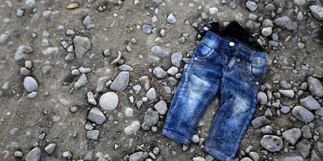 A pair of jeans from a refugee child is seen on a beach at the Greek island of Lesbos November 16, 2015. Of the 660,000 refugees and migrants who have reached Greece this year more than half have landed at Lesvos. So far this year, some 3,460 lives have been lost crossing the Mediterranean, 360 in the last four weeks alone with 250 of these in Greek territorial waters UNHCR spokesperson Adrian Edwards told a press briefing in Geneva on November 13. REUTERS/Yannis Behrakis TPX IMAGES OF THE DAY