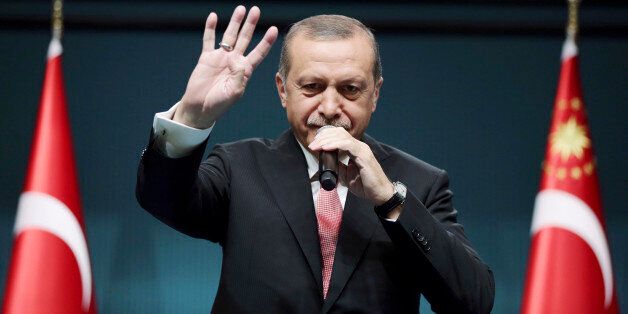 Turkey's President Recep Tayyip Erdogan speaks after an emergency meeting of the government in Ankara, Turkey, late Wednesday, July 20, 2016. Erdogan on Wednesday declared a three-month state of emergency following a botched coup attempt, declaring he would rid the military of the