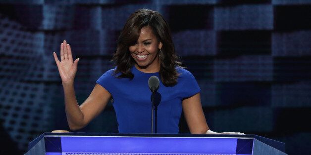 PHILADELPHIA, PA - JULY 25: First lady Michelle Obama acknowledges the crowd after delivering remarks on the first day of the Democratic National Convention at the Wells Fargo Center, July 25, 2016 in Philadelphia, Pennsylvania. An estimated 50,000 people are expected in Philadelphia, including hundreds of protesters and members of the media. The four-day Democratic National Convention kicked off July 25. (Photo by Alex Wong/Getty Images)