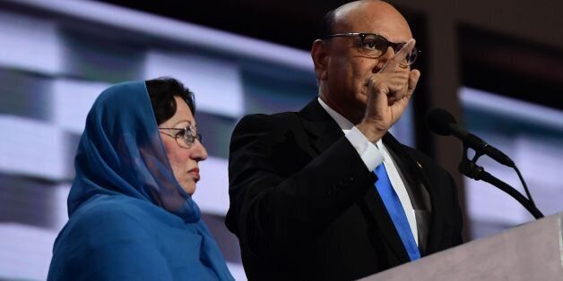 Khizr Khan (R), accompanied by his wife Ghazala Khan (L), speaks about their son US Army Captain Humayun Khan who was killed by a suicide bomber in Iraq 12 years ago, on the final night of the Democratic National Convention at the Wells Fargo Center, July 28, 2016 in Philadelphia, Pennsylvania. / AFP / Robyn BECK (Photo credit should read ROBYN BECK/AFP/Getty Images)