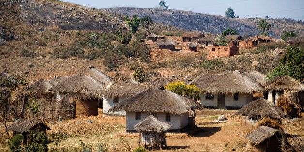 'Malawi, Dedza. Grass roofed houses in a rural village in the Dedza region.'