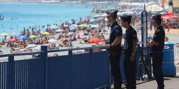 French police officers patrol on the famed Promenade des Anglais in Nice, southern France, three days after a truck mowed through revelers, Sunday, July 17, 2016. French authorities detained two more people Sunday in the investigation into the Bastille Day truck attack on the Mediterranean city of Nice that killed at least 84 people, as authorities try to determine whether the slain attacker was a committed religious extremist or just a very angry man. (AP Photo/Luca Bruno)