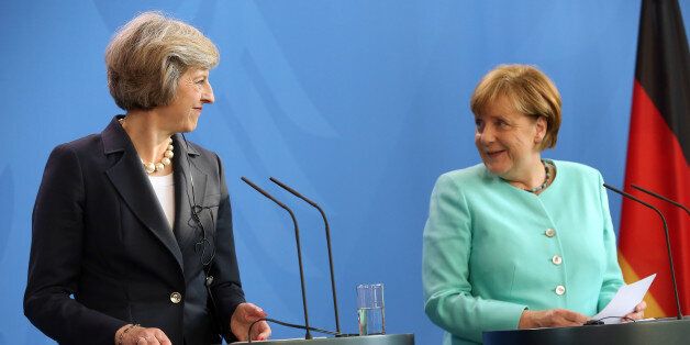 BERLIN, GERMANY - JULY 20: Theresa May, Prime Minister of the United Kingdom (L), attends a press conference with German Chancellor Angela Merkel on July 20, 2016 in Berlin, Germany. The two leaders discussed their upcoming cooperation together as well as the United Kingdom's withdrawing of its membership from the European Union, known as Brexit. (Photo by Adam Berry/Getty Images)