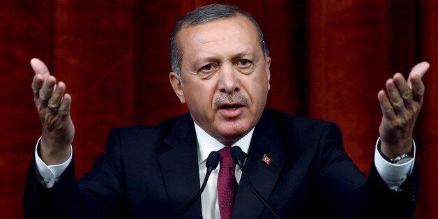 Turkey President Recep Tayyip Erdogan delivers a speech commenting on those killed and wounded during a failed July 15 military coup, in Ankara, Turkey, late Friday, July 29, 2016. The government crackdown in the coup's aftermath has strained Turkey's ties with key allies including the United States. (AP Photo/Kayhan Ozer Presidential Press Service, via AP Pool)