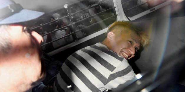 Satoshi Uematsu, suspected of a deadly attack at a facility for the disabled, is seen inside a police car as he is taken to prosecutors, at Tsukui police station in Sagamihara, Kanagawa prefecture, Japan, in this photo taken by Kyodo July 27, 2016. Mandatory credit Kyodo/via REUTERS ATTENTION EDITORS - THIS IMAGE WAS PROVIDED BY A THIRD PARTY. EDITORIAL USE ONLY. MANDATORY CREDIT. JAPAN OUT. NO COMMERCIAL OR EDITORIAL SALES IN JAPAN. TPX IMAGES OF THE DAY