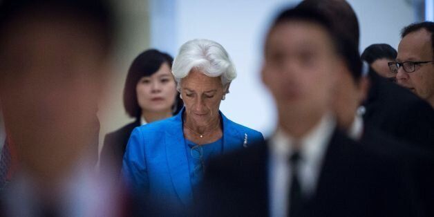 International Monetary Fund (IMF) managing-director Christine Lagarde (C) leaves the G20 finance ministers meeting in Chengdu, in China's Sichuan province on July 24, 2016.Government representatives and central bank chiefs from the world's top 20 economies have gathered in the southwestern Chinese city of Chengdu on July 23-24 with the impact of Britain's vote to leave the European Union (EU) high on the agenda. / AFP / FRED DUFOUR (Photo credit should read FRED DUFOUR/AFP/Getty Images)