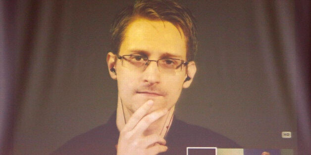 Former U.S. National Security Agency contractor Edward Snowden appears live via video during a meeting about whistle blowers at the Council of Europe in Strasbourg, France, June 23, 2015. REUTERS/Vincent Kessler