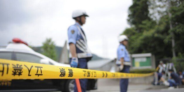 SAMIGAHARA, JAPAN - JULY 26 : Police are seen on the site where Satoshi Uematsu, 26, killed 19 and wounding 25 in knife attack in a residential care for people with disabilities on July 26, 2016, in Sagimahara city, Kanagawa Prefecture, in western of Tokyo, Japan. (Photo by David Mareuil/Anadolu Agency/Getty Images)
