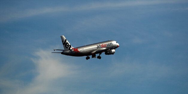 A Airbus SAS A320 aircraft operated by Jetstar Airways, the budget arm of Qantas Airways Ltd., takes off at Sydney Airport in Sydney, Australia, on Monday, June 22, 2015. Australia's central bank reiterated the need for deeper currency declines to balance economic growth that's predicted to remain below average until the latter part of 2016. 'A lower exchange rate would have an immediate beneficial effect on some sectors such as tourism,' the Reserve Bank said in minutes of its June policy meeting. Photographer: Brendon Thorne/Bloomberg via Getty Images