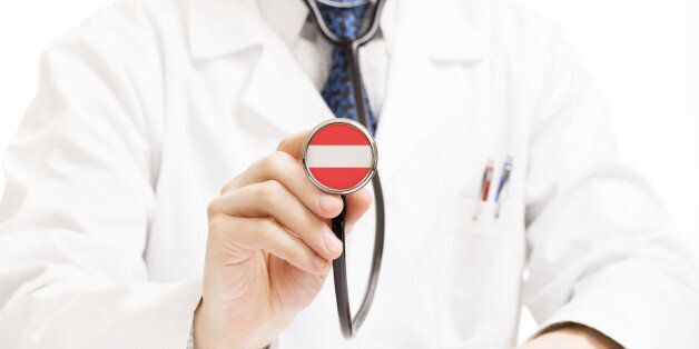 Doctor holding stethoscope with flag series - Austria