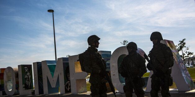 Military soldiers patrol Maua Square ahead of the 2016 Olympic Games in Rio de Janeiro, Brazil, on Saturday, July 9, 2016. Rio de Janeiro will use about 85,000 soldiers and police to secure the games, about twice as many as London four years ago. About 10,500 athletes are expected for the Olympics with 300,000 to 500,000 foreign tourists. Photographer: Dado Galdieri/Bloomberg via Getty Images