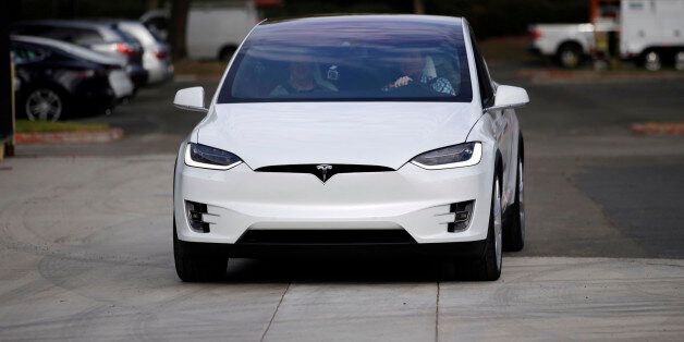 The Tesla Model X car is test driven at the company's headquarters Tuesday, Sept. 29, 2015, in Fremont, Calif. Tesla's Model X â one of the only all-electric SUVs on the market â was officially unveiled Tuesday night near the company's California factory. (AP Photo/Marcio Jose Sanchez)