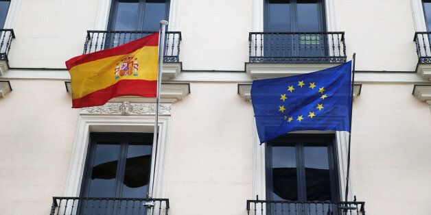 The European Union flag and the Spanish flag are seen on the Department of Education building in Madrid, Spain, May 18, 2016. REUTERS/Juan Medina