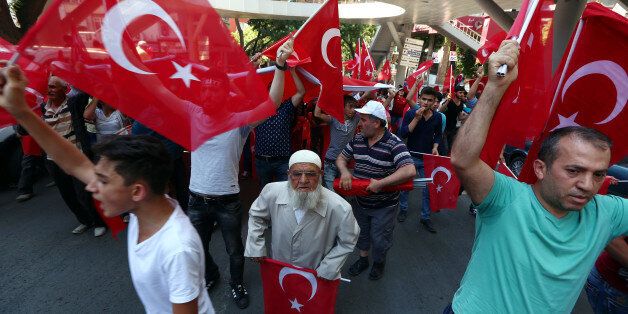 People arrive to attend funerals of the victims killed in a failed military coup last Friday, during their funeral at Kocatepe Mosque in Ankara, Turkey, Sunday, July 17, 2016. The Turkish government accelerated its crackdown on alleged plotters of the failed coup against President Recep Tayyip Erdogan, with the justice minister saying Sunday that 6,000 people had been detained in the investigation, including three of the country's top generals and hundreds of soldiers. (AP Photo/Ali Unal)