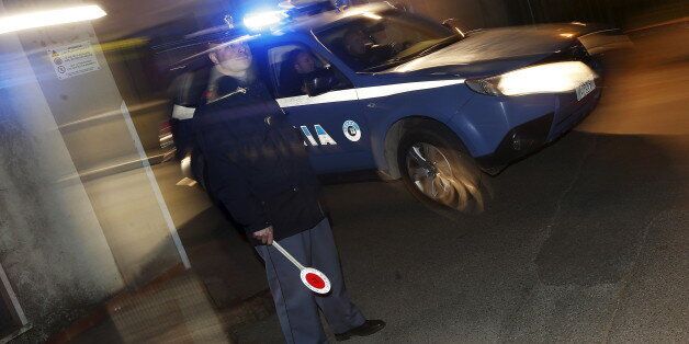 An Italian police car leaves a police station for Operation Columbus in Pianopoli village, near Catanzaro, Italy May 7, 2015. Italian and U.S. agents broke up a major cocaine trafficking network between Central America, the United States and Europe on Thursday, detaining 13 Italians suspected of links to organised crime, police said. REUTERS/Alessandro Bianchi