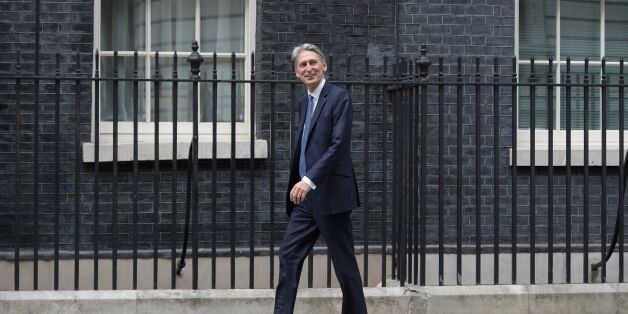 British Foreign Secretary Philip Hammond walks to 10 Downing Street in central London on July 13, 2016 after New British Prime Minister Theresa May takes office following the formal resignation of David Cameron. Theresa May took office as Britain's second female prime minister on July 13 charged with guiding the UK out of the European Union after a deeply devisive referendum campaign ended with Britain voting to leave and David Cameron resigning. / AFP / OLI SCARFF (Photo credit should read OLI SCARFF/AFP/Getty Images)
