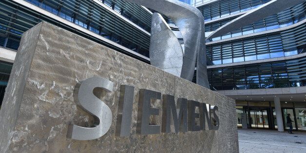 The main entrance of the new headquarters of the German engineering giant Siemens in Munich, southern Germany, is pictured on June 14, 2016.The new building was designed and built in the past six years, provides future jobs for 1,200 employees and will be officially opened at the end of June 2016. / AFP / CHRISTOF STACHE (Photo credit should read CHRISTOF STACHE/AFP/Getty Images)