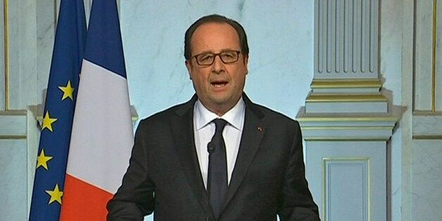 French President Francois Hollande makes a televised address in Paris early Friday July 15, 2016 after a truck drove onto a sidewalk for more than a mile, plowing through Bastille Day revelers who'd gathered to watch fireworks in the French resort city of Nice on Thursday, July 14. (French Pool via AP)