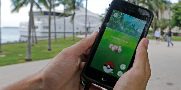 Exeggcute, a Pokemon, is found by a Pokemon Go player, Tuesday, July 12, 2016, at Bayfront Park in downtown Miami. The
