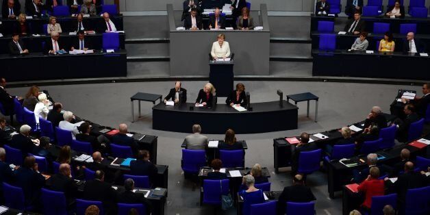 German chancellor Angela Merkel addresses lower house of Parliament Bundestag in Berlin ahead of NATO summit in Warsaw on July 7, 2016. / AFP / John MACDOUGALL (Photo credit should read JOHN MACDOUGALL/AFP/Getty Images)