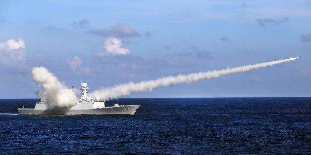 In this Friday, July 8, 2016 photo released by Xinhua News Agency, Chinese missile frigate Yuncheng launches an anti-ship missile during a military exercise in the waters near south China's Hainan Island and Paracel Islands. They are controlled by Beijing but also claimed by Vietnam and Taiwan. China's navy is holding a week of military drills around the disputed islands ahead of a ruling by an international tribunal in a case filed by the Philippines challenging China's claim to most of the Sou