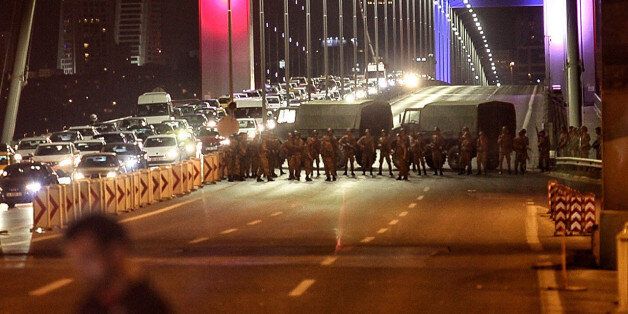 ISTANBUL, TURKEY - JULY 15: Turkish soldiers block Istanbul's Bosphorus Bridge on July 15, 2016 in Istanbul, Turkey. Istanbul's bridges across the Bosphorus, the strait separating the European and Asian sides of the city, have been closed to traffic. Reports have suggested that a group within Turkey's military have attempted to overthrow the government. Security forces have been called in as Turkey's Prime Minister Binali Yildirim denounced an 'illegal action' by a military 'group', with bridges