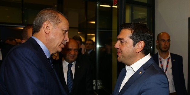 WARSAW, POLAND - JULY 9: President of Turkey Recep Tayyip Erdogan speaks with Prime Minister of Greece Alexis Tsipras (R) in Warsaw, Poland on July 9, 2016. (Photo by Kayhan Ozer/Anadolu Agency/Getty Images)