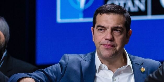 Prime Ministers of Greece Alexis Tsipras (L) and Iceland Sigurdur Ingi Johannsson (R) chat before the second session of the second day of a NATO summit on July 9, 2016 in Warsaw, Poland.The Polish capital Warsaw hosts a two-day top-level NATO meeting for the first time since Poland joined the alliance in 1999. / AFP / WOJTEK RADWANSKI (Photo credit should read WOJTEK RADWANSKI/AFP/Getty Images)