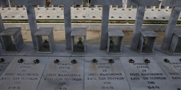 Graves of persons killed during the 1974 Turkish invasion of Cyprus, while the words in Greek read