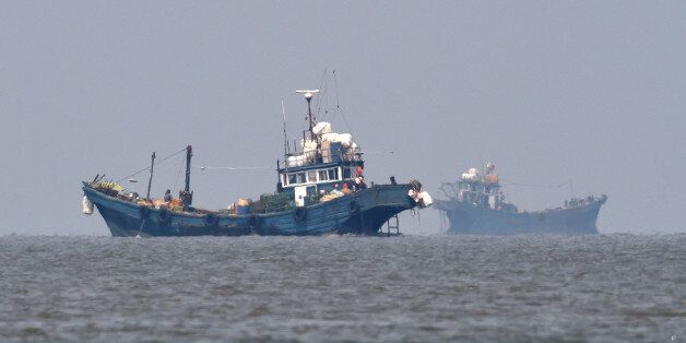 In this photo provided by the South Korean Defense Ministry, Chinese fishing boats are seen in neutral waters around Ganghwa island, South Korea, Friday, June 10, 2016. South Korean military vessels started an operation Friday to repel Chinese fishing boats illegally harvesting prized blue crabs from an area near Seoul's disputed sea boundary with North Korea. (The South Korean Defense Ministry via AP)
