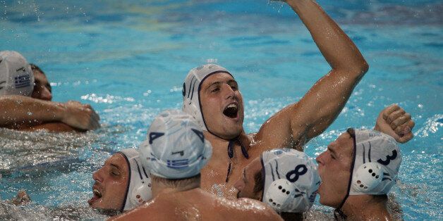 KAZAN, RUSSIA - AUGUST 08: The Greece team celebrates after defeating the Italy team in their Men's bronze medal match with a score of 11 to 9 on day fifteen of the 16th FINA World Championships at the Water Polo Arena on August 8, 2015 in Kazan, Russia. (Photo by Adam Pretty/Getty Images)