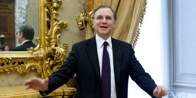 FILE - In this December 16, 2011 file photo, Italy's central bank chief Ignazio Visco gestures as he arrives for a commemoration in Rome. Visco, in an interview published Sunday, Aug. 5 2012 in La Repubblica daily, says there's no need