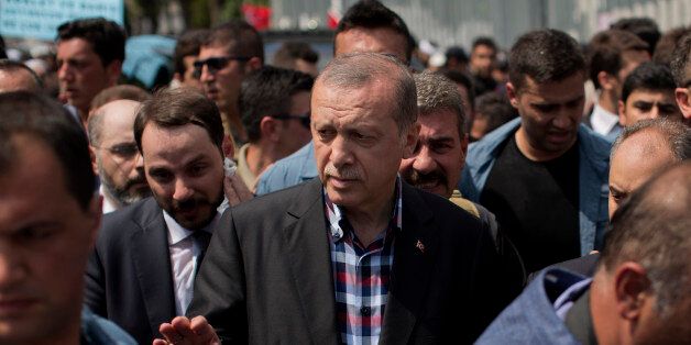 Turkish President Recep Tayyip Erdogan leaves the mosque after attending a funeral for people killed Friday while protesting against the attempted coup against Turkey's government, in Istanbul, Sunday, July 17, 2016. Rather than toppling Turkey's strongman president, a failed military coup appears to have bolstered Erdogan's immediate grip on power and boosted his popularity. (AP Photo/Emilio Morenatti)