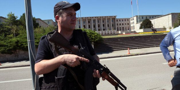 A police officer stands outside Turkey's parliament near the Turkish military headquarters in Ankara, Turkey, Saturday, July 16, 2016. Forces loyal to Turkey's President Recep Tayyip Erdogan quashed a coup attempt in a night of explosions, air battles and gunfire that left dozens dead Saturday. Authorities arrested thousands of people as President Recep Tayyip Erdogan vowed those responsible