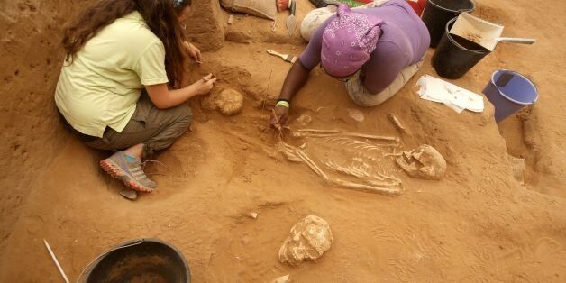 A team of foreign archaeologists extract skeletons at the excavation site of the first Philistine cemetery ever found on June 28, 2016 in the Mediterranean coastal Israeli city of Ashkelon. With an excavation in southern Israel unearthing a Philistine cemetery for the first time, bones of the biblical giant Goliath's people can finally shed new light on mysteries of their culture. The cemetery's discovery marks the 'crowning achievement' of some three decades of excavations in the area, the expedition's organisers say. / AFP / MENAHEM KAHANA / TO GO WITH AFP STORY BY DAPHNE ROUSSEAU (Photo credit should read MENAHEM KAHANA/AFP/Getty Images)