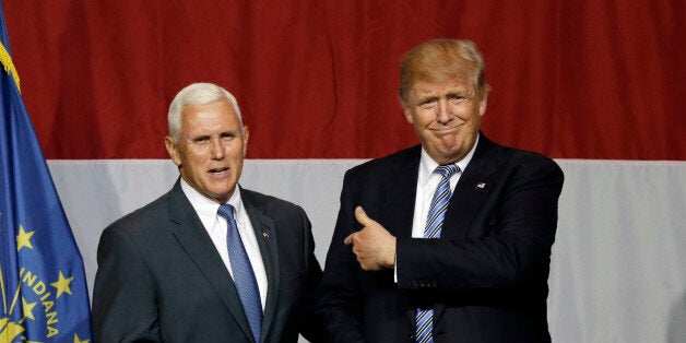 Indiana Gov. Mike Pence joins Republican presidential candidate Donald Trump at a rally in Westfield, Ind., Tuesday, July 12, 2016. (AP Photo/Michael Conroy)